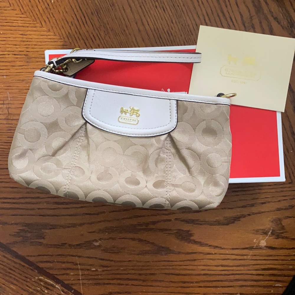 coach neutral c logo and white leather large wristlet